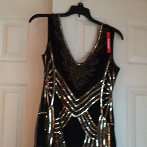 NWT sequined dress, never worn , can fit a Small or Medium .
